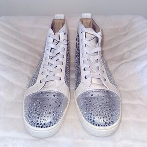 Men’s Christian Louboutin sneakers in white and silver.